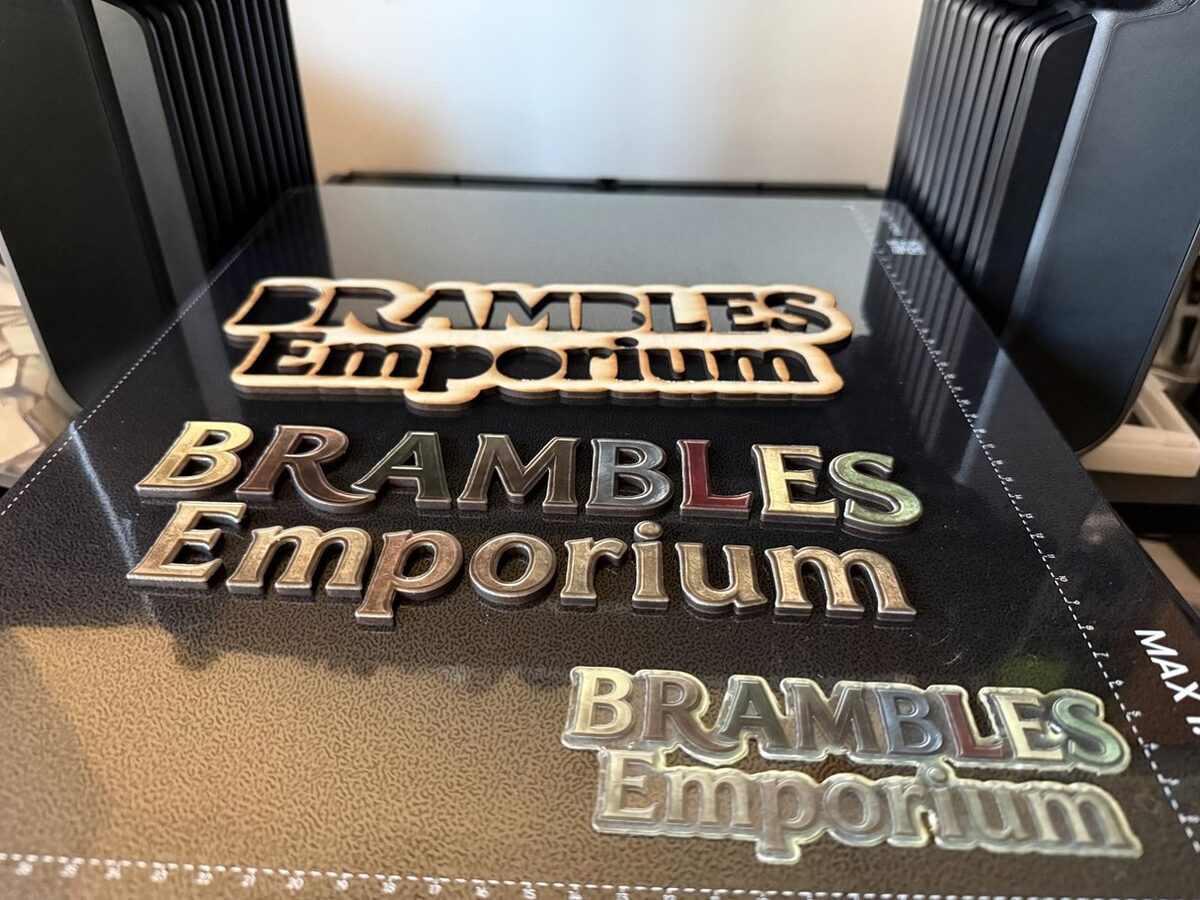 Business logo signage for Brambles Emporium: laser-cut wood and multi-colour UV-printed raised lettering